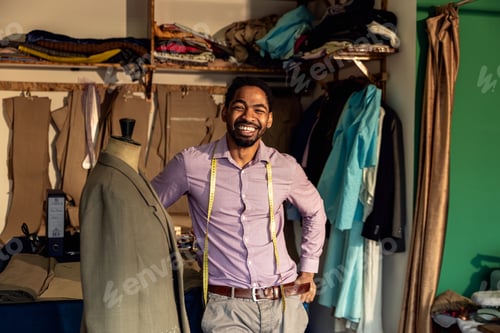 Preview: Portrait of male fashion tailor in his workshop.