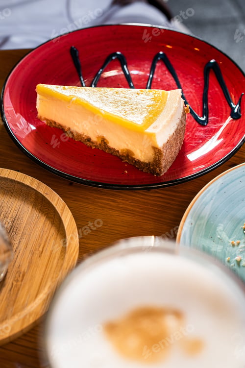 Preview: Classic New York strawberries and lemon Cheesecake on a wooden table in cafe. Top view