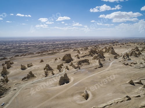 Preview: Aerial view of landscape in desert under blue sky