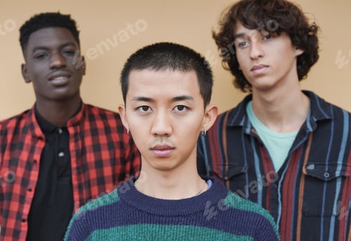 Preview: Young multiracial boys looking serious - Diversity and friendship concept