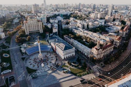 Preview: Maidan Nezalezhnosti square, Khreshchatyk and Dnieper river - aerial drone view. Flight over capital