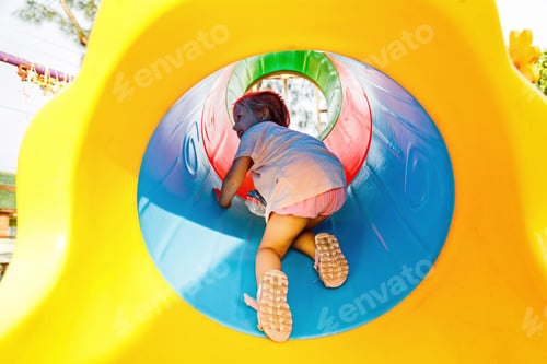 Preview: Child playing on kids playground