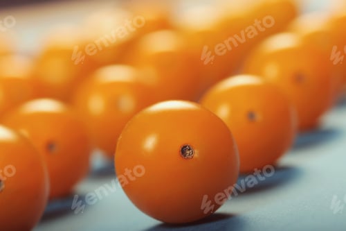 Preview: Tomatoes Are Small Yellow Lying On A Bright Background