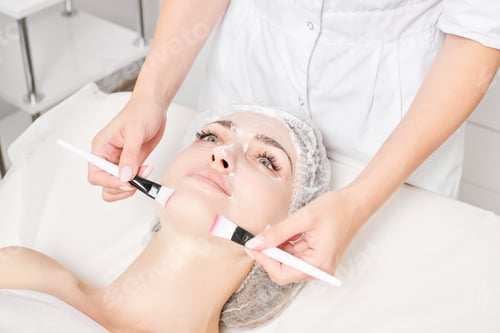Preview: Woman Receiving Facial Mask with Brushes in Spa