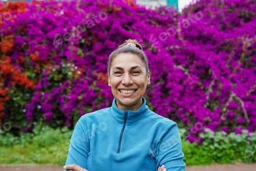 Preview: Portrait of mature latin woman smiling on camera outdoor