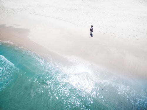 Preview: Lonely person standing on beach shore