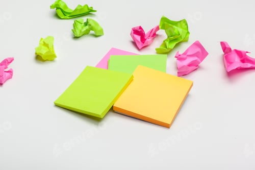 Preview: crumpled paper on white table brainstorming in the office concept