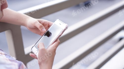 Preview: Woman using mobile smartphone