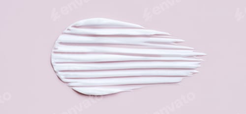 Preview: close-up cosmetic smear cream texture on pastel pink background