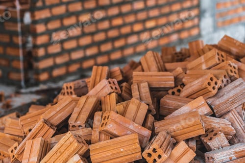 Preview: Stack of Brick preparing for mansonry over the photo blurred of Bricks wall background,