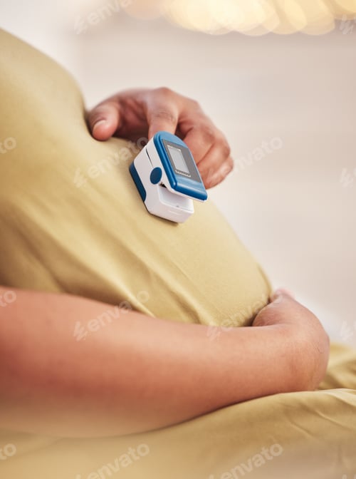 Preview: Pregnant belly, hands and closeup with care, blood pressure machine or self care for healthcare in