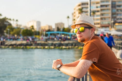 Preview: Portrait of an attractive young man on a beach