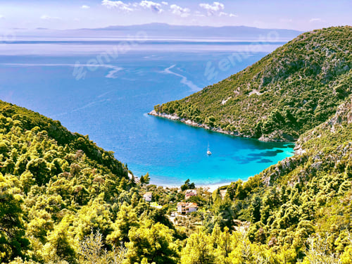 Preview: Various blues of the ocean along one of the bays of Skopelos island Greece