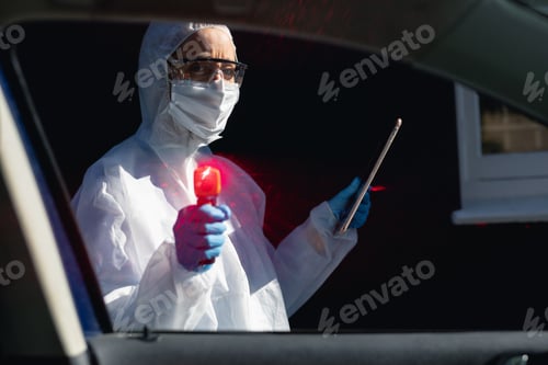 Preview: Caucasian woman wearing a lab overalls and coronvirus covid19 mask outsdide
