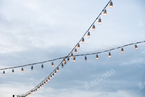 Preview: Antique light bulbs crossing with hanging on wire