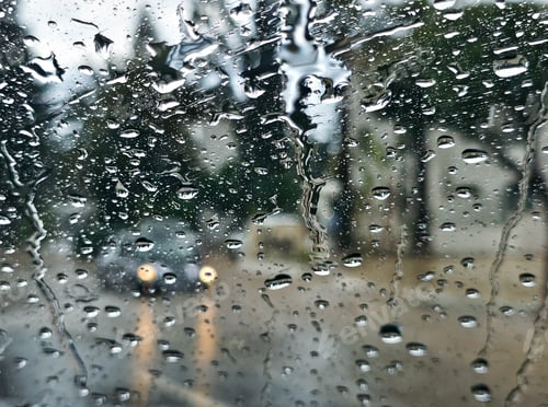 Preview: Raindrops on glass window creating a beautiful abstract background