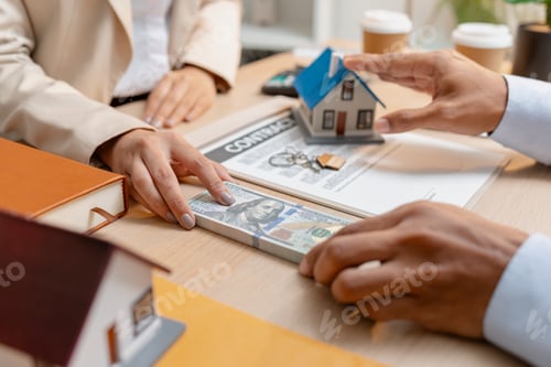 Preview: A real estate agent presents a property sale contract to a client