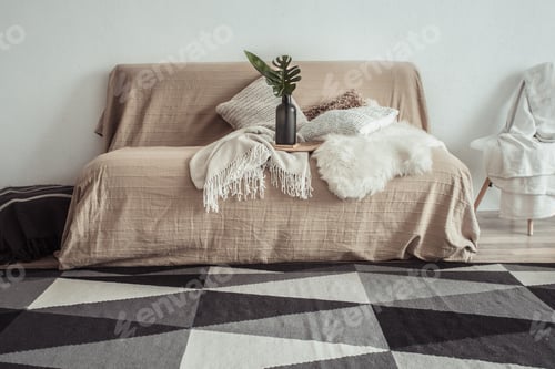 Preview: interior of the living room with a sofa and decorative items .