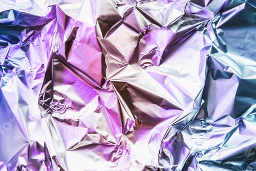 Preview: Crumpled colorful foil background. Abstract pattern. Neon pink and blue colors.
