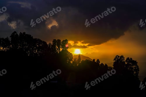 Preview: gloomy sunset over the mountain