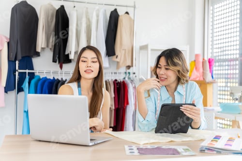 Preview: Two Asian women working together Small business