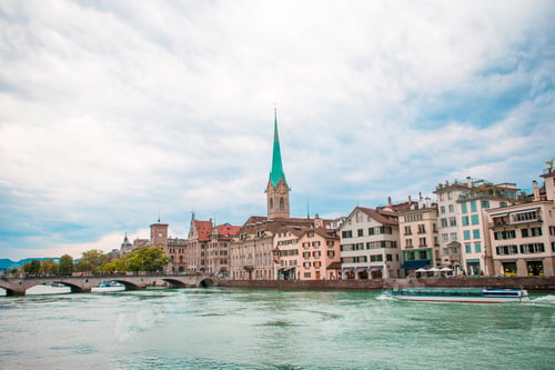 Preview: View of the historic city center of Zurich with famous Fraumunster Church and river Limmat