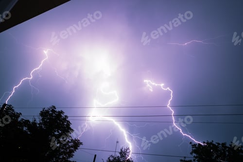 Preview: Thunderbolt over the house and dark stormy sky on the background