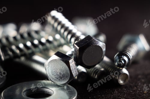 Preview: Close-up photo of a set of fasteners on a black surface