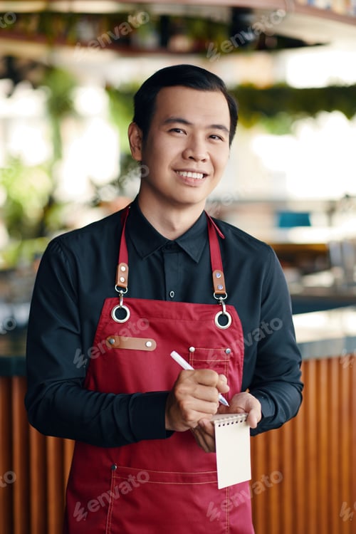 Preview: Smiling Waiter Writing down Order