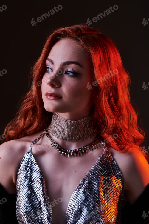 Preview: Elegant woman in silver attire radiates charm in a mystical castle core setting