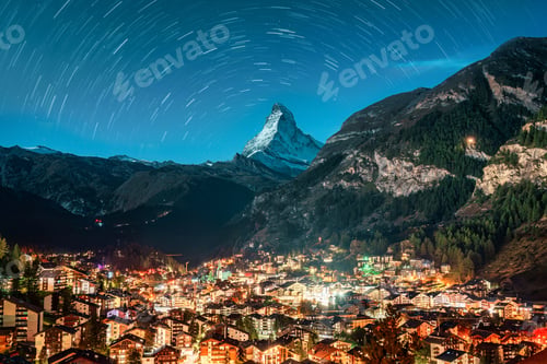 Preview: Zermatt rural town glowing in the alps with Matterhorn peak in the night at Valais, Switzerland