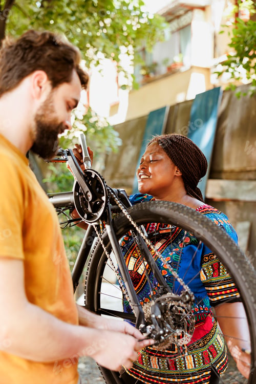 Preview: Healthy woman greasing bicycle chain
