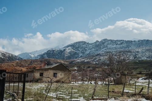 Preview: Panoramic view of the snow-capped mountains with huts