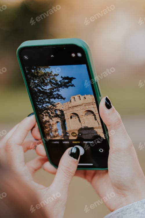 Preview: Girl taking a photo of a colosseum