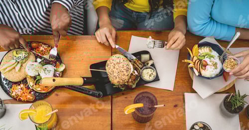Preview: Top view of multiracial friends having healthy lunch in coffee brunch bar