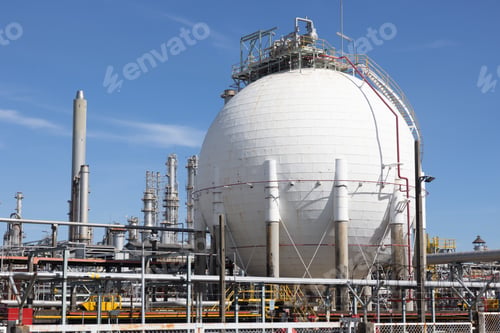 Preview: Oil refinery plant against blue sky