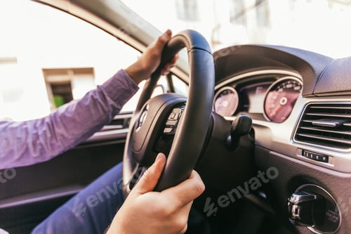 Preview: Close-up of a male hand in a modern car