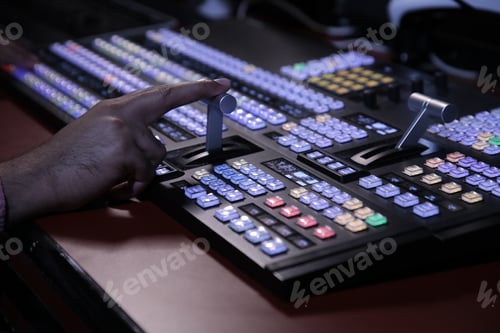 Preview: Hands on dissolve of Switcher buttons in studio TV station, Audio and Video Production Switcher of T