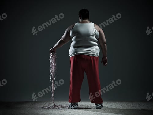 Preview: Overweight woman holding measuring tape