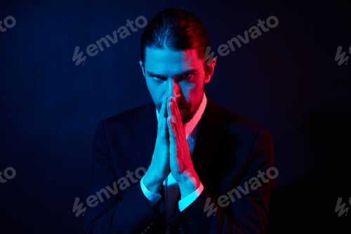 Preview: portrait of a man in costume posing fashion dark background