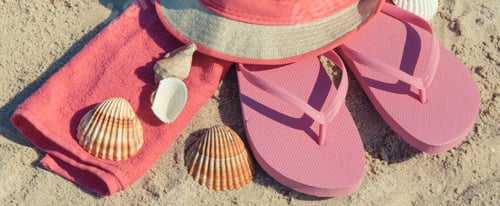 Preview: Different accessories using for relax on beach. Straw hat, flip flop and towel. Summertime