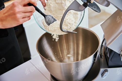 Preview: Woman cooking at kitchen and using kitchen machine