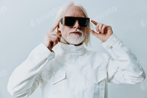 Preview: Stylish elderly man with long white hair wearing oversized sunglasses in a modern minimalist setting
