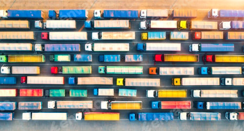 Preview: Aerial view of colorful trucks in terminal at sunrise in summer