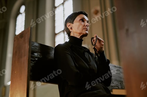 Preview: Woman Sitting on Bench in Church