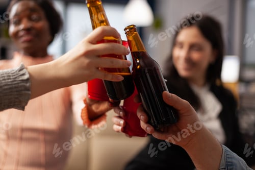 Preview: Office colleagues making toast and clinking glasses of alcohol