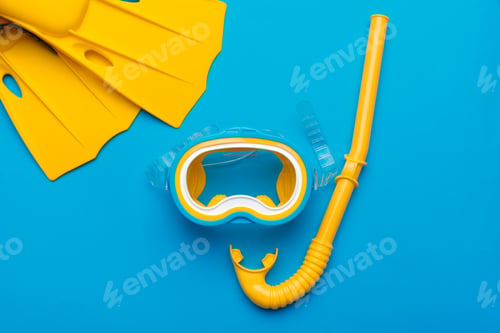 Preview: Bright yellow snorkeling gear arranged on a blue background for underwater exploration