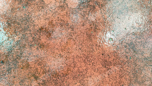 Preview: orange cement background wet with water. rust orange concrete texture water effect background