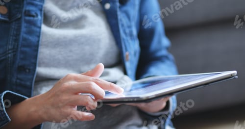 Preview: Woman use of tablet computer at home