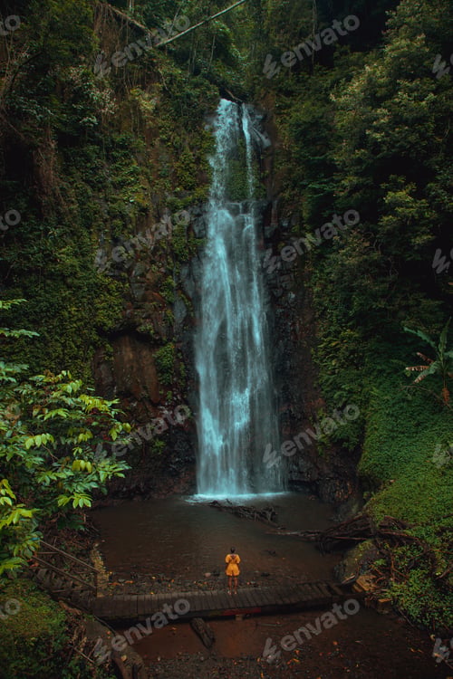 Preview: Scenic waterfall cascading near rocks and autumn trees, San-Tome and Principe